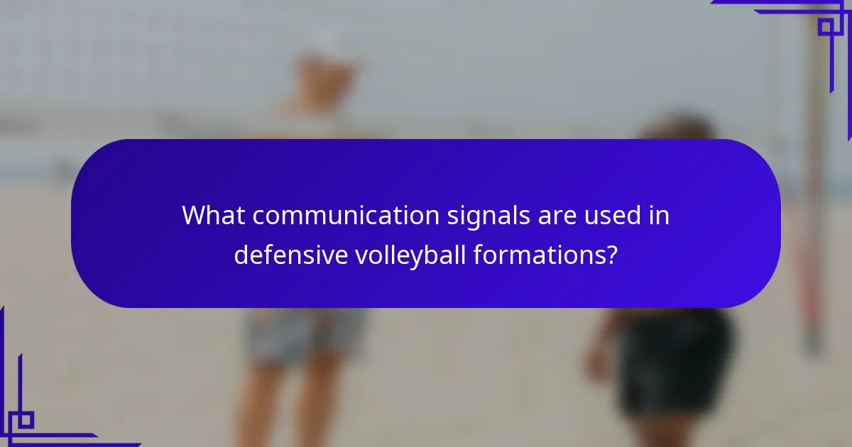 What communication signals are used in defensive volleyball formations?